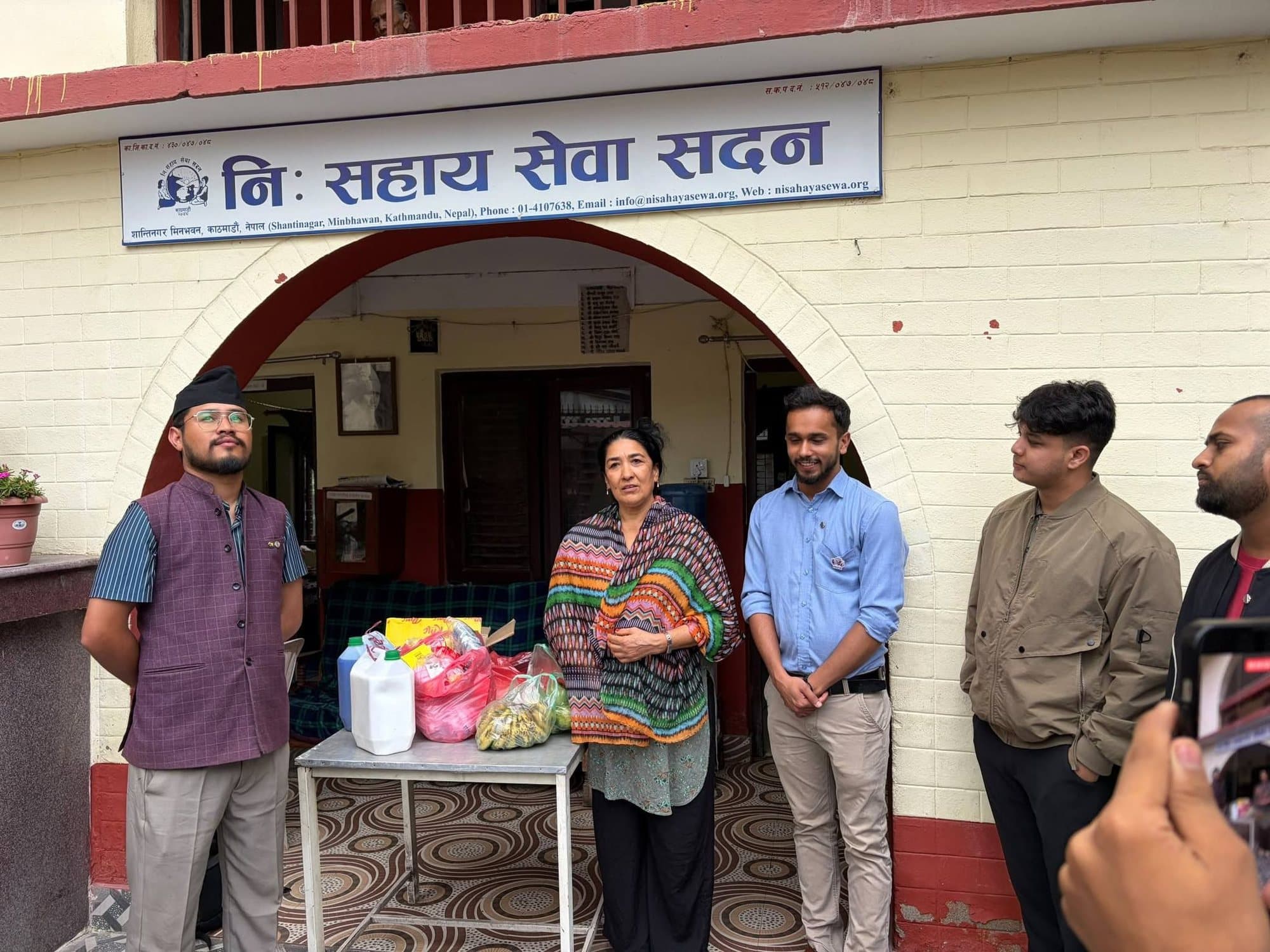 Leo members hand over food and supplies to staff at the Nisahaya Sewa Sadan care home.